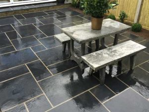 Slate patio with concrete bench