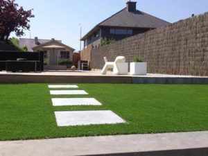 Timber garden design with white path and artificial grass