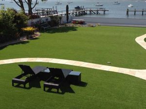 Artificial grass with path and sun bed design