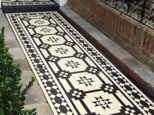 Victorian tile front path with brick wall